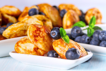 Mini pancakes with fresh blueberries