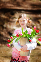 adorable little girl with tulips