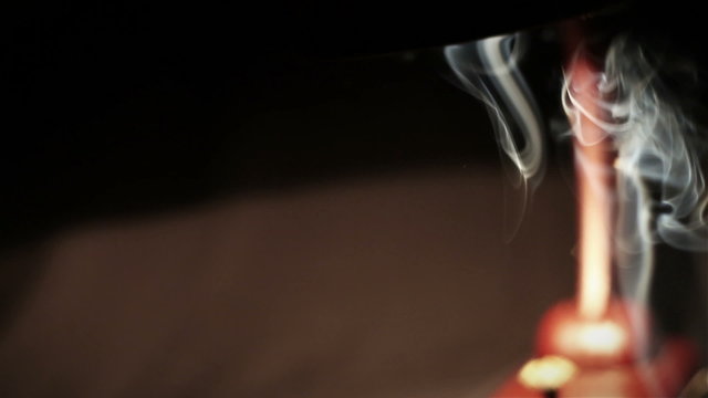 Pipe / cigar smoke under the night desktop lamp