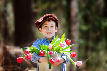 child wearing newsboy hat with tulips