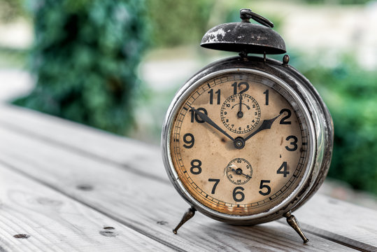 Landscape With Old Alarm Clock