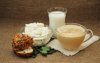 Still life with fresh homemade dairy products and bread.