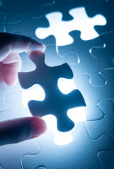 Hand insert jigsaw, conceptual image of business strategy, decis