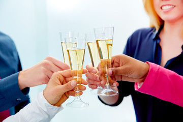Happy business team toasting with champagne