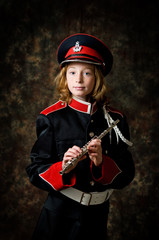 girl in a marching band uniform with a flute © sianc