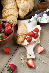 Fresh pastries with cream cheese and strawberries
