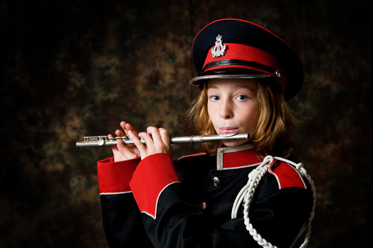 girl in a marching band uniform with a flute