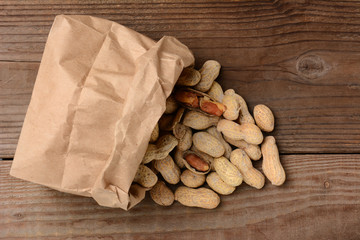 Peanuts Spilling From Brown Paper Bag