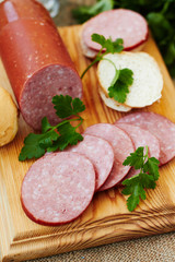 Sliced salami on cutting board