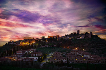 Fototapeta na wymiar Sunset stormy light in Monticciello Village, Tuscany, Italy