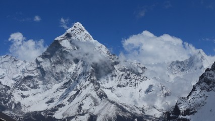 Peak of Ama Dablam surrounded by clouds