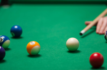 Pool game balls against a green