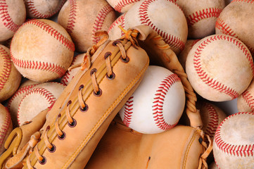 Glove on Pile of Old Baseballs