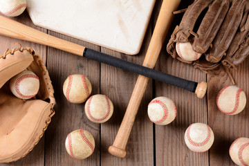 Fototapeta na wymiar Baseball Gear on Rustic Wood Surface