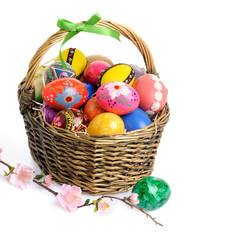 basket of Easter eggs isolated on white
