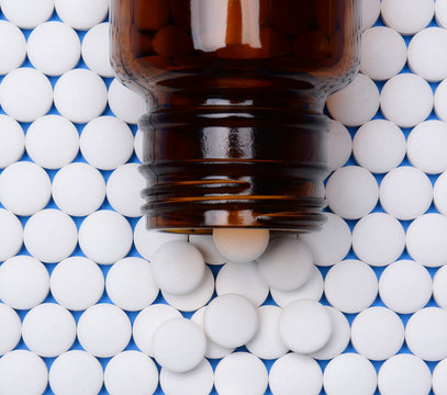 Aspirin In Rows With Bottle On Top