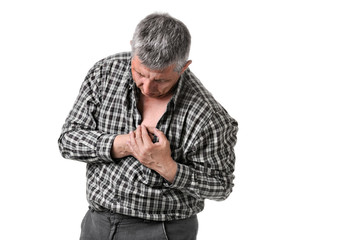 man holding his chest - maybe a heart attack