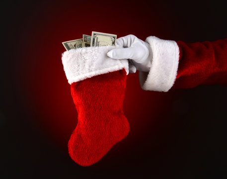 Santa Claus Holding a Stocking Full of Cash