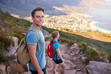 Positive male student on a nature trail hike