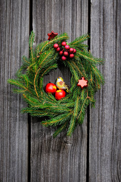 Christmas wreath on the wooden background
