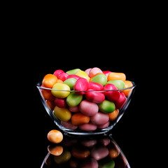 olorful candies snack on black