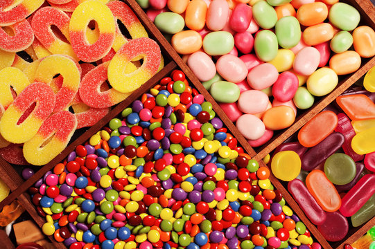 assortment of candy for a background, in a printers box.