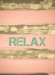 Fototapeta premium RELAX written on vintage painted wooden wall