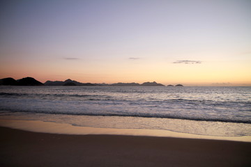 Fototapeta na wymiar Photo taken during sunrise at Copacabana beach in Rio de Janeiro, Brazil. 