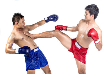 Fototapeta na wymiar Two thai boxers exercising traditional martial art