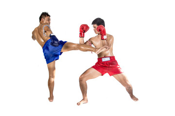 Two thai boxers exercising traditional martial art