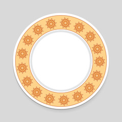 Decorative plate on gray background, top view