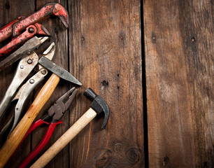 Set of different tools on wooden background