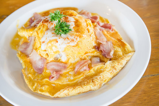 scrambled omlette eggs with bacon on rice