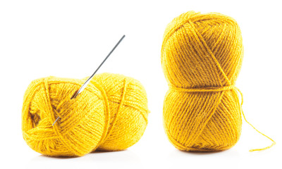 Yellow wool yarn isolated on white background