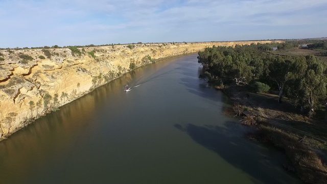Elevated aerial view of river murray cliffs at big bend near nildottie featuring great tourism holidays with water ski fun and river flats covered in tall gum trees along the murray river banks