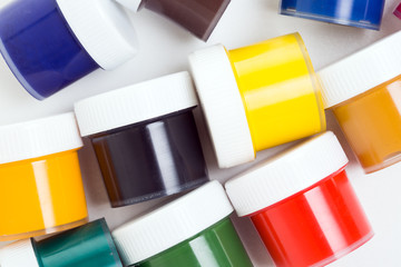 jars of gouache on a white background