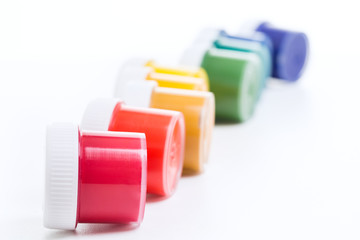 jars of gouache on a white background