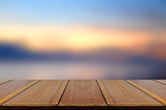 Blurred Sunrise Background, Early Morning Light with Wooden Table.