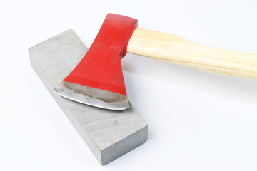Stone sharpening an ax on a white background.