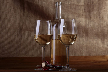 Two glasses and bottle of white wine