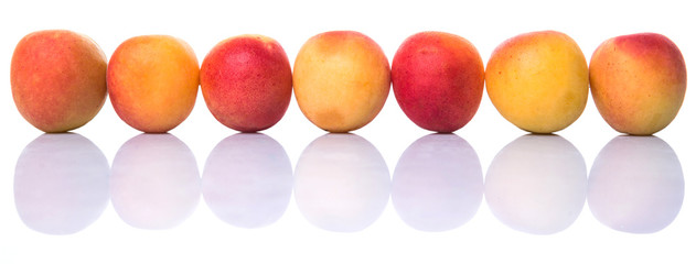 Ripe apricot over white background