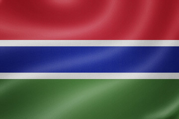 Gambia flag on the fabric texture background