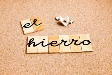 Words formed from small pieces of wood containing a sun and beach tourist destination, El Hierro