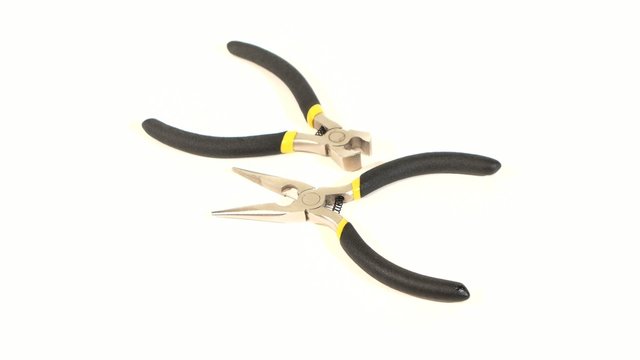 Wire cutters and mini cutters on white, rotation