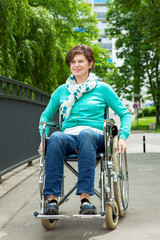 Woman with wheelchair in the park