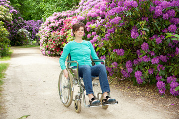 Woman with wheelchair in the park