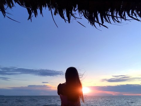 behide girl and sunset 