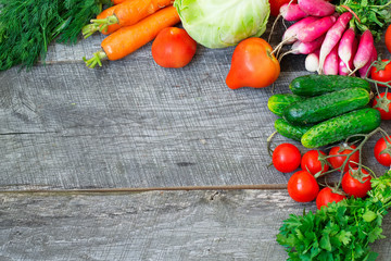 Sets with organic vegetables on a wooden background.Copy space b