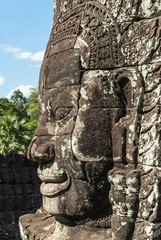 tower as metaphor of the mount meru with the head of lokeshvara and the face of jayavarman VII in the complex of the bayon in the archaeological angkor thom place in siam reap, cambodia