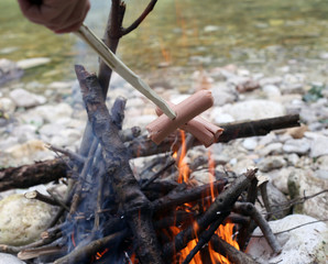 roasted sausage cooked in fire during the summer camp